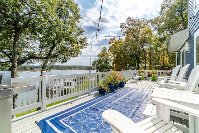 deck featuring a water view