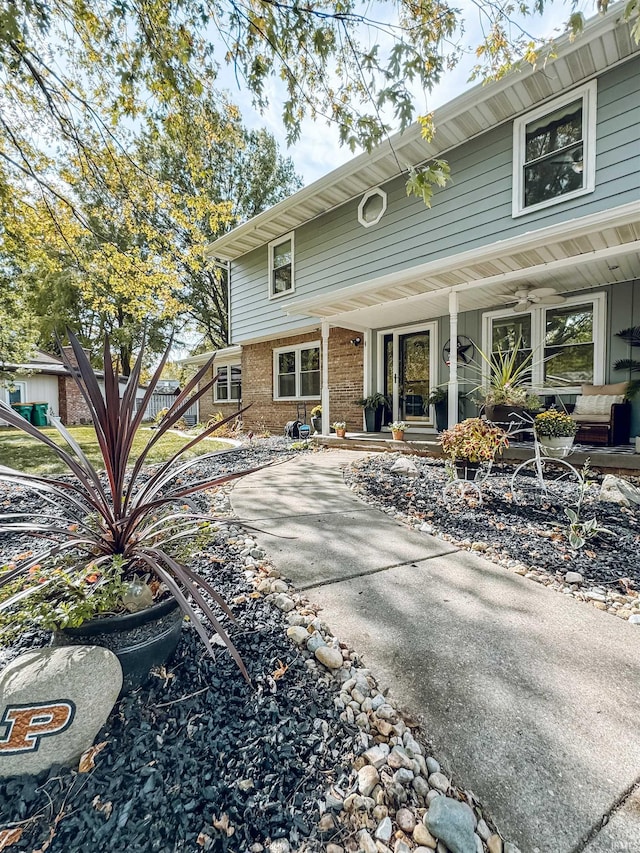 rear view of property with a porch