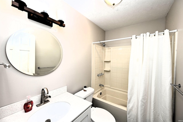 full bathroom featuring shower / bath combination with curtain, vanity, toilet, and a textured ceiling