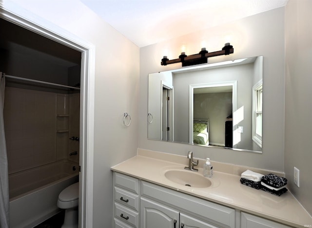 full bathroom featuring shower / bath combo, vanity, and toilet