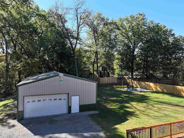 view of yard with an outbuilding and a garage