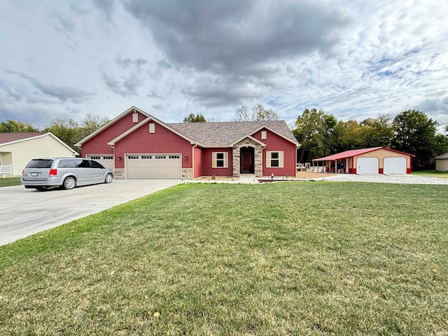 view of front of home featuring a front yard and a garage