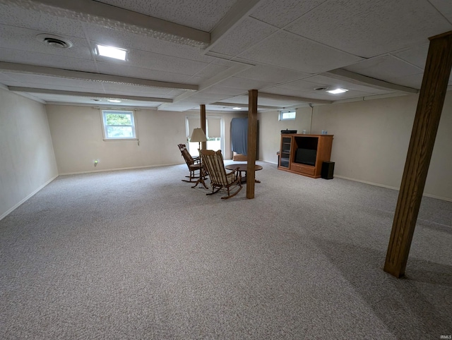 basement with carpet floors and a drop ceiling