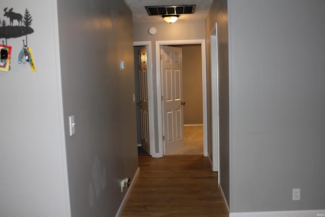 hallway featuring dark hardwood / wood-style floors