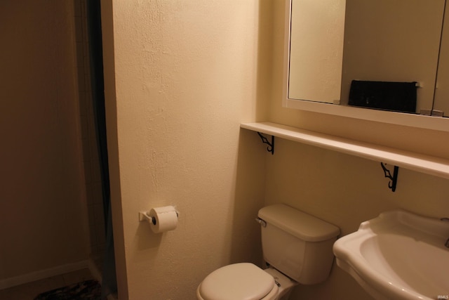 bathroom featuring sink and toilet