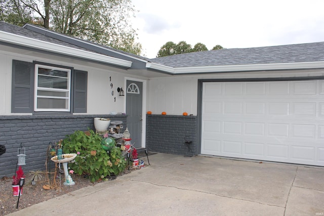 view of exterior entry with a garage