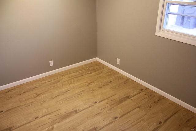 empty room featuring wood-type flooring