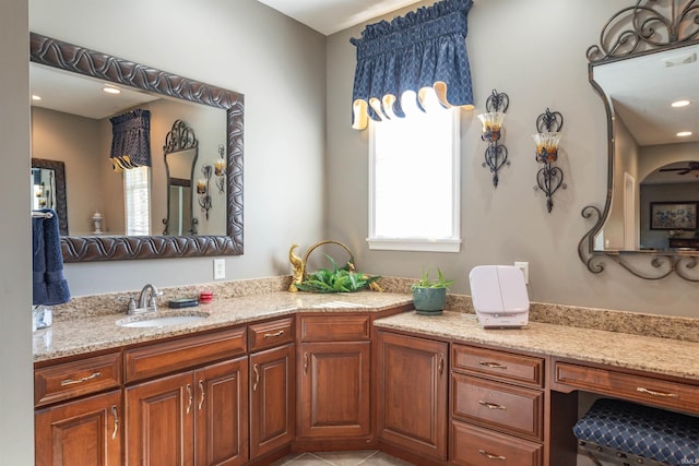 bathroom featuring tile patterned flooring, vanity, and ceiling fan