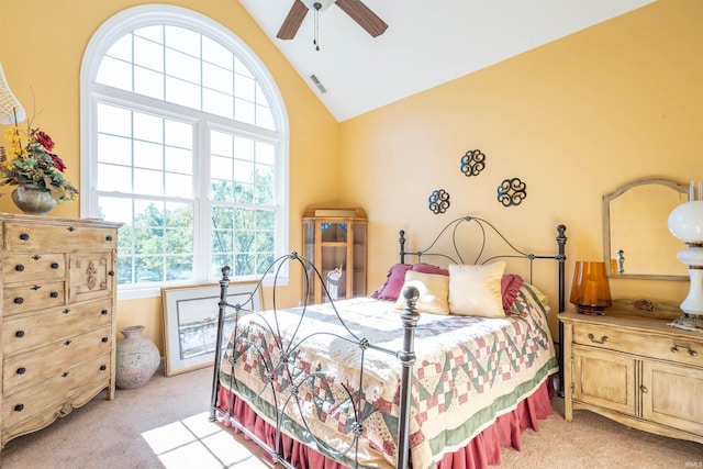 bedroom featuring lofted ceiling, light carpet, and ceiling fan