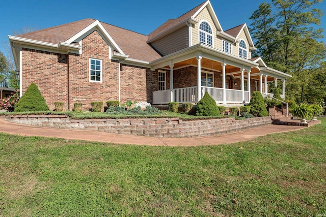 view of front facade featuring a front lawn and covered porch