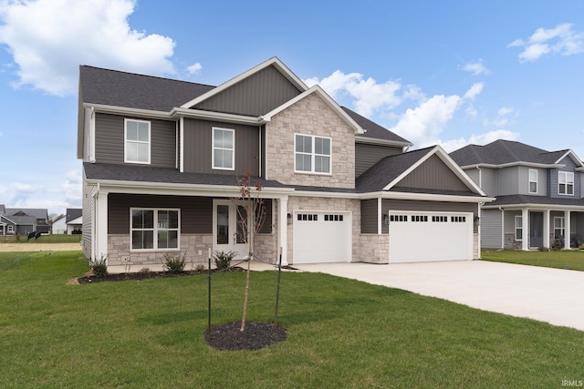 craftsman-style home featuring a garage and a front lawn