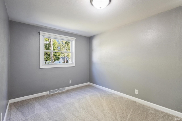 empty room featuring carpet flooring