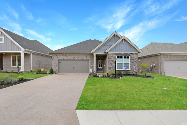 craftsman house with a front yard and a garage