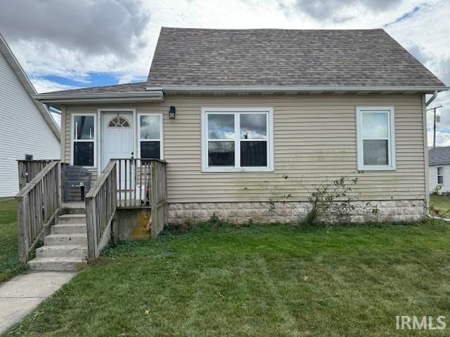 bungalow-style house with a front yard