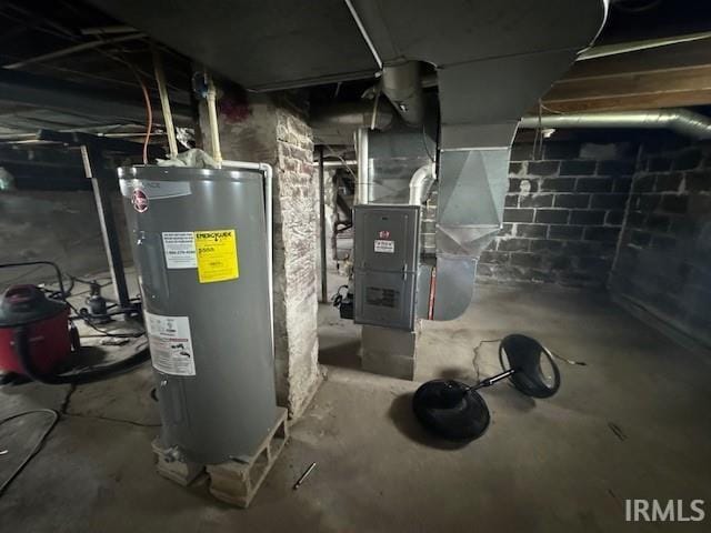 utilities featuring electric water heater and heating unit