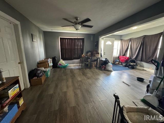 interior space featuring hardwood / wood-style floors and ceiling fan