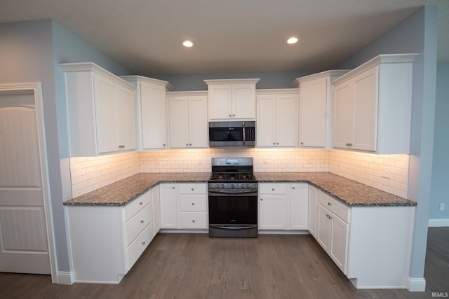 kitchen featuring tasteful backsplash, range with gas stovetop, dark hardwood / wood-style flooring, and white cabinetry