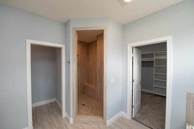 bathroom with a shower and hardwood / wood-style flooring