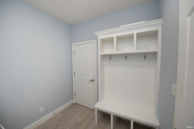 mudroom with light hardwood / wood-style floors