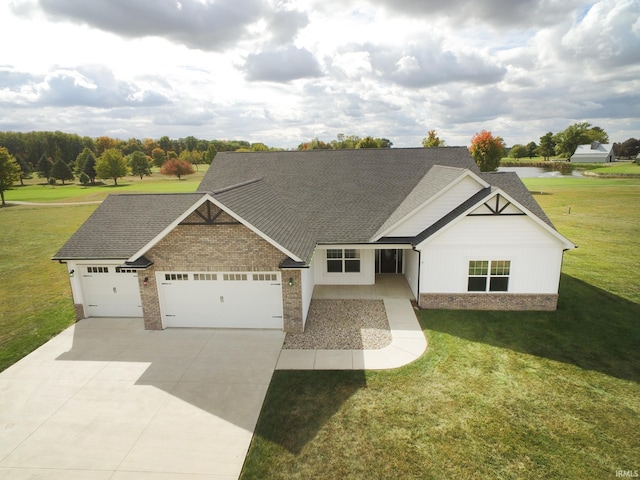 view of front of house with a front yard and a garage