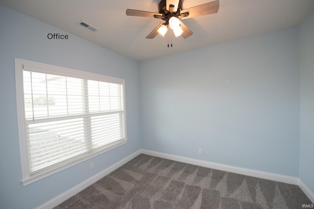 carpeted empty room with ceiling fan