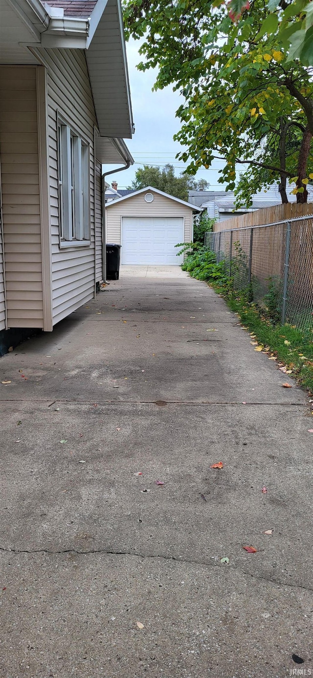 view of property exterior with an outbuilding and a garage