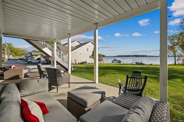 view of patio featuring an outdoor living space and a water view