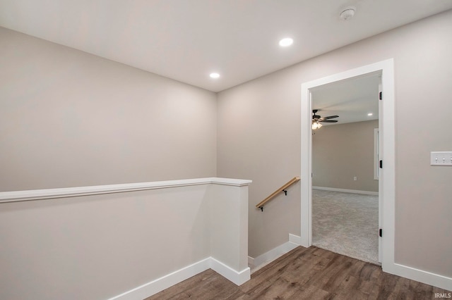 interior space with ceiling fan and hardwood / wood-style flooring