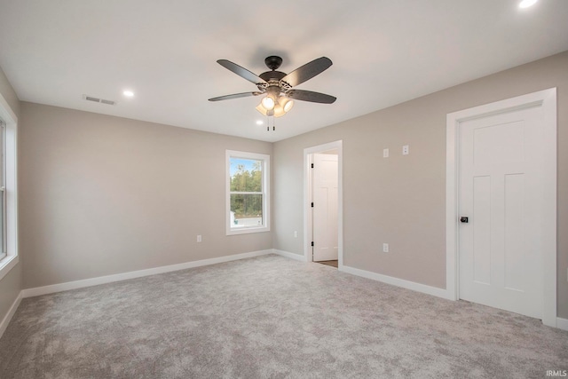 carpeted empty room with ceiling fan