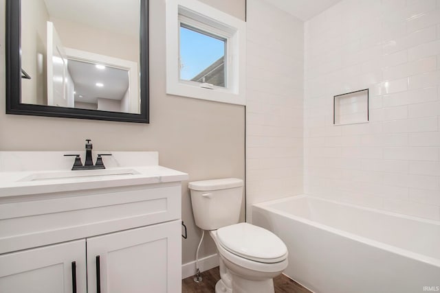 full bathroom with wood-type flooring,  shower combination, vanity, and toilet