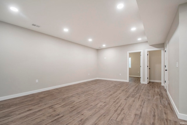 empty room with light hardwood / wood-style floors