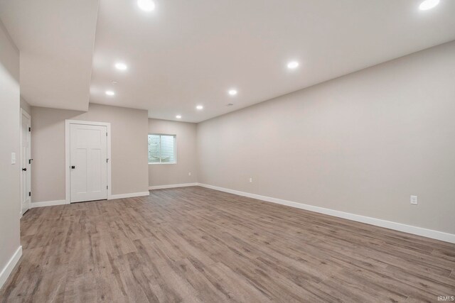 unfurnished room with light hardwood / wood-style floors