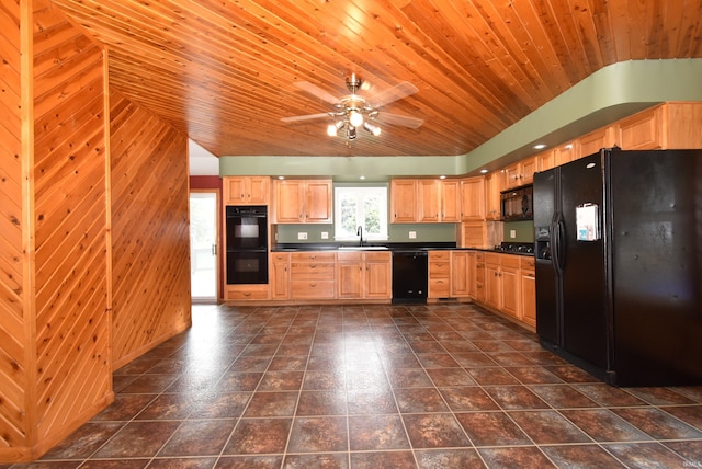 kitchen featuring dark tile patterned flooring, lofted ceiling, sink, wood ceiling, and black appliances