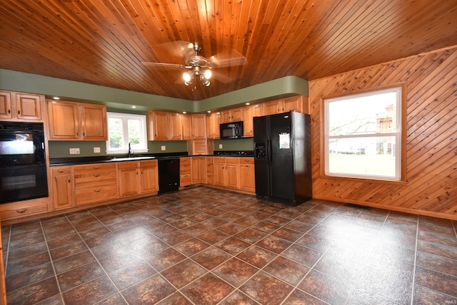 kitchen with wood walls, wooden ceiling, and black appliances