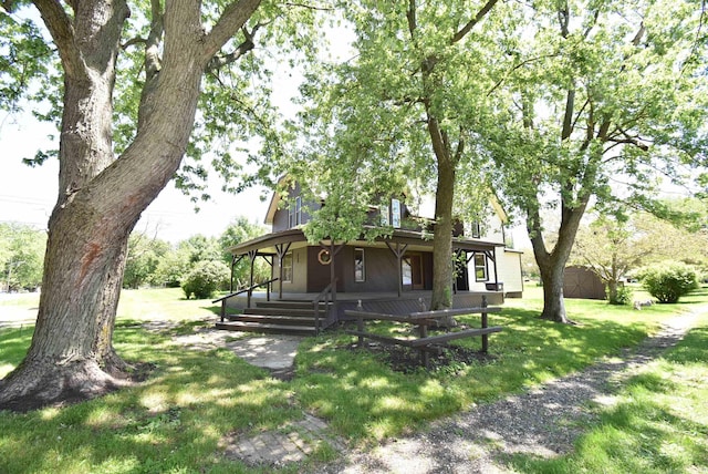 view of front of home featuring a porch and a front yard