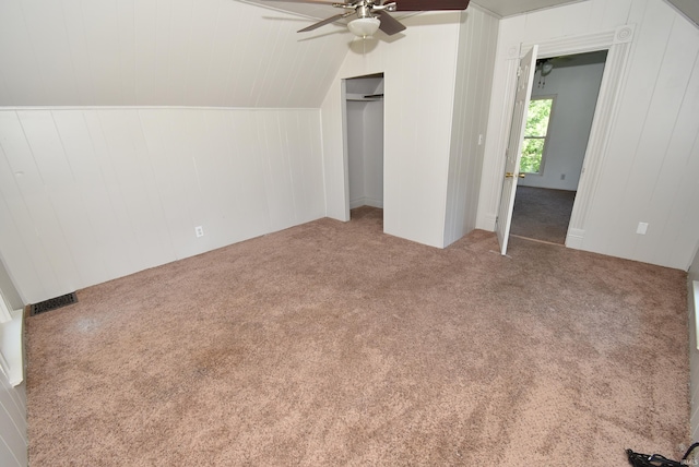 unfurnished bedroom with lofted ceiling, carpet flooring, and ceiling fan