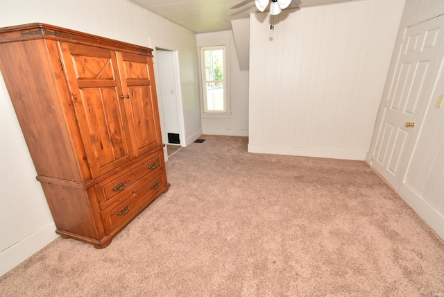 interior space featuring ceiling fan