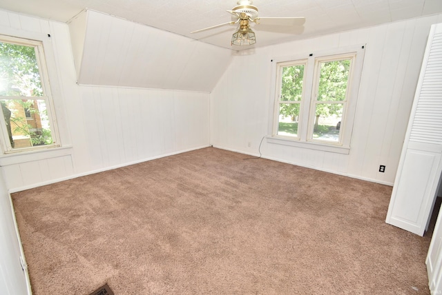 bonus room with carpet floors, vaulted ceiling, and ceiling fan