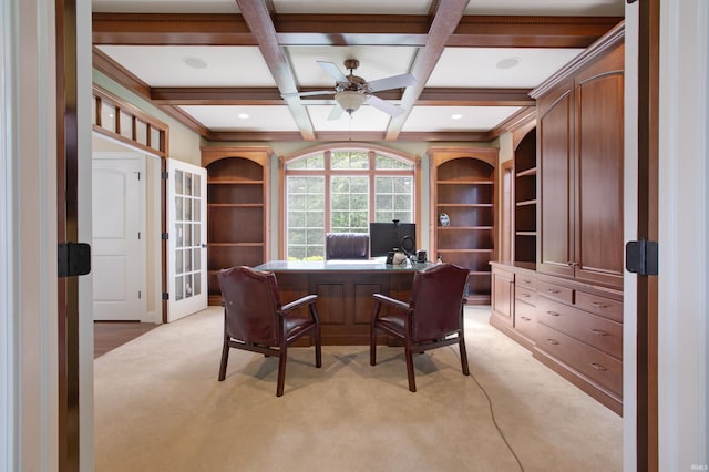 carpeted home office with ceiling fan, beam ceiling, and coffered ceiling