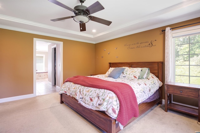 bedroom featuring ornamental molding, ensuite bathroom, ceiling fan, and light carpet