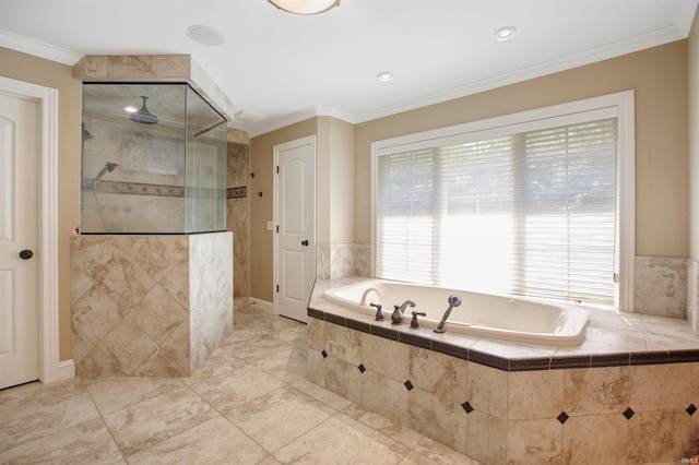 bathroom with ornamental molding and shower with separate bathtub