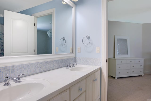 bathroom with ornamental molding and vanity