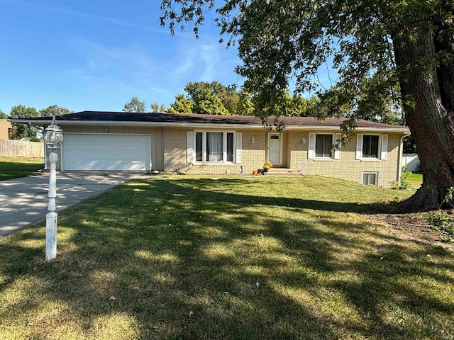 single story home with a front yard and a garage