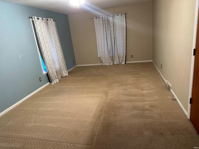 spare room with carpet floors