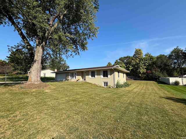 exterior space with a yard and a garage