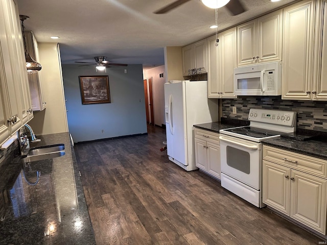 kitchen featuring white appliances, sink, backsplash, a textured ceiling, and dark hardwood / wood-style floors