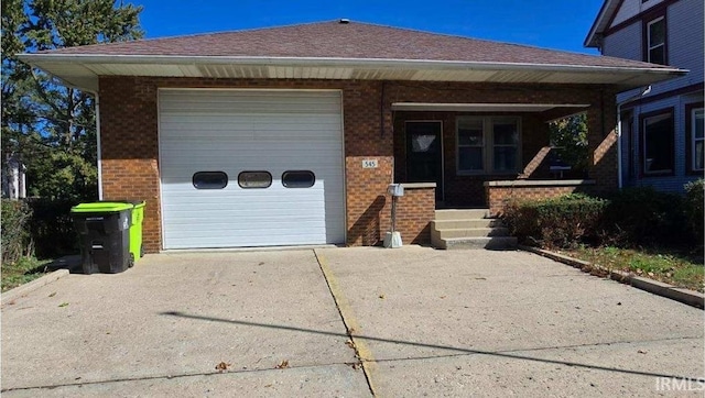 ranch-style house featuring a garage and a porch