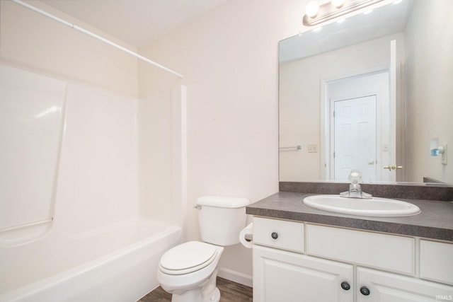 full bathroom featuring vanity, hardwood / wood-style flooring, toilet, and shower / bath combination