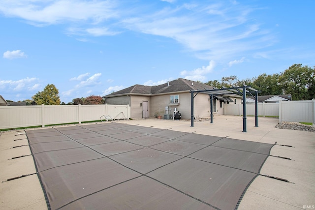 view of swimming pool with a patio and a pergola