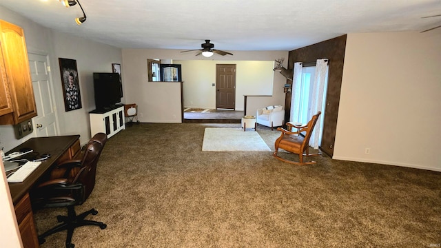 interior space featuring ceiling fan and dark carpet